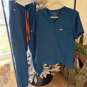Figs Deep Blue Scrub Set with Bright Orange Accents